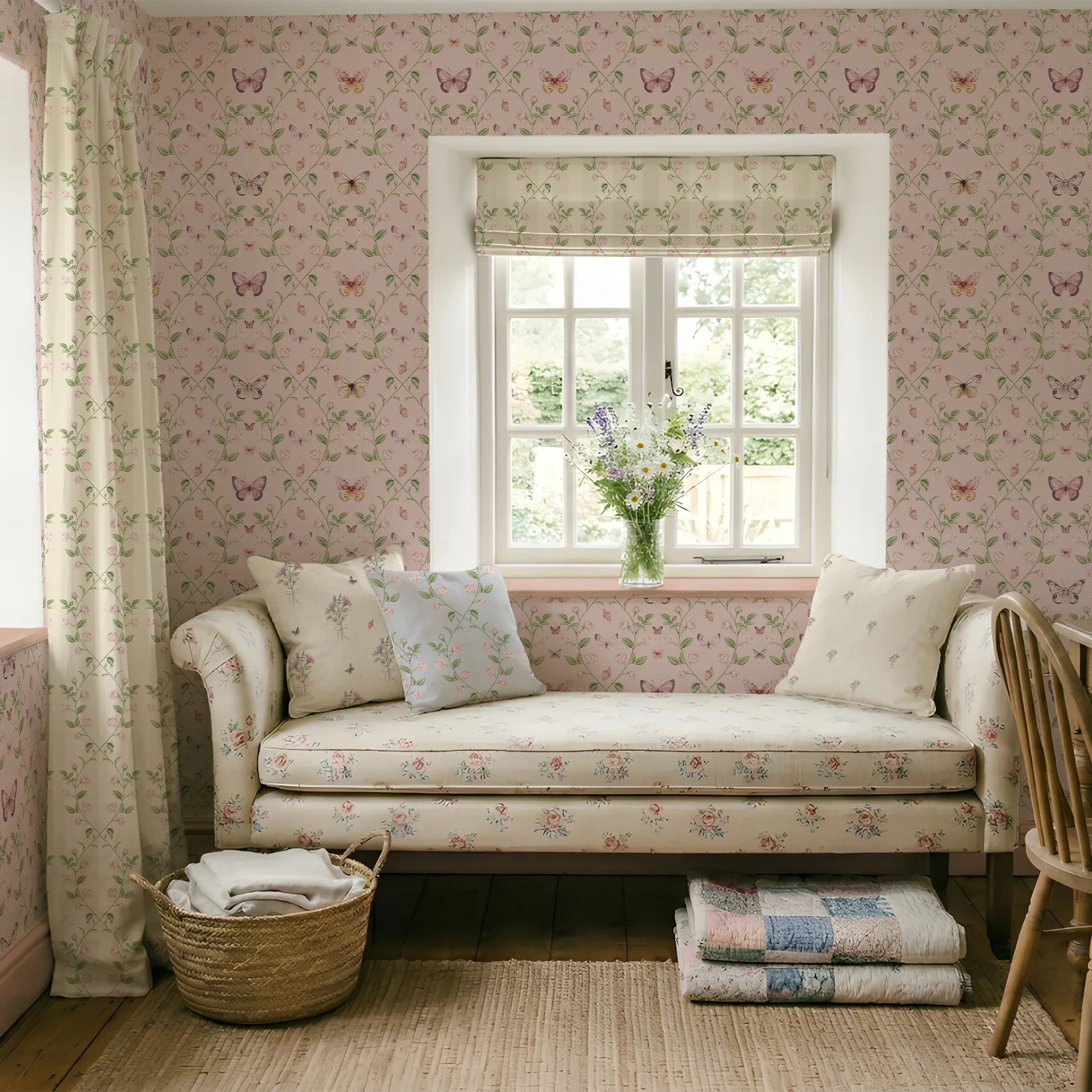 Cozy room with floral and butterfly wallpaper, a daybed, and a window with a view of greenery.