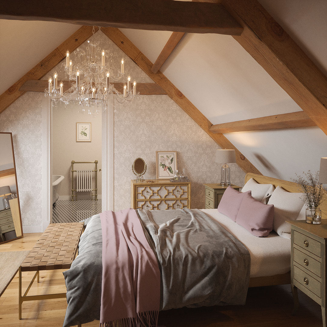 Spaceous bedroom setting with a bathroom entrance. Broad wooden beams on ceiling and a light grey damask wallpaper featuring on the far wall. 