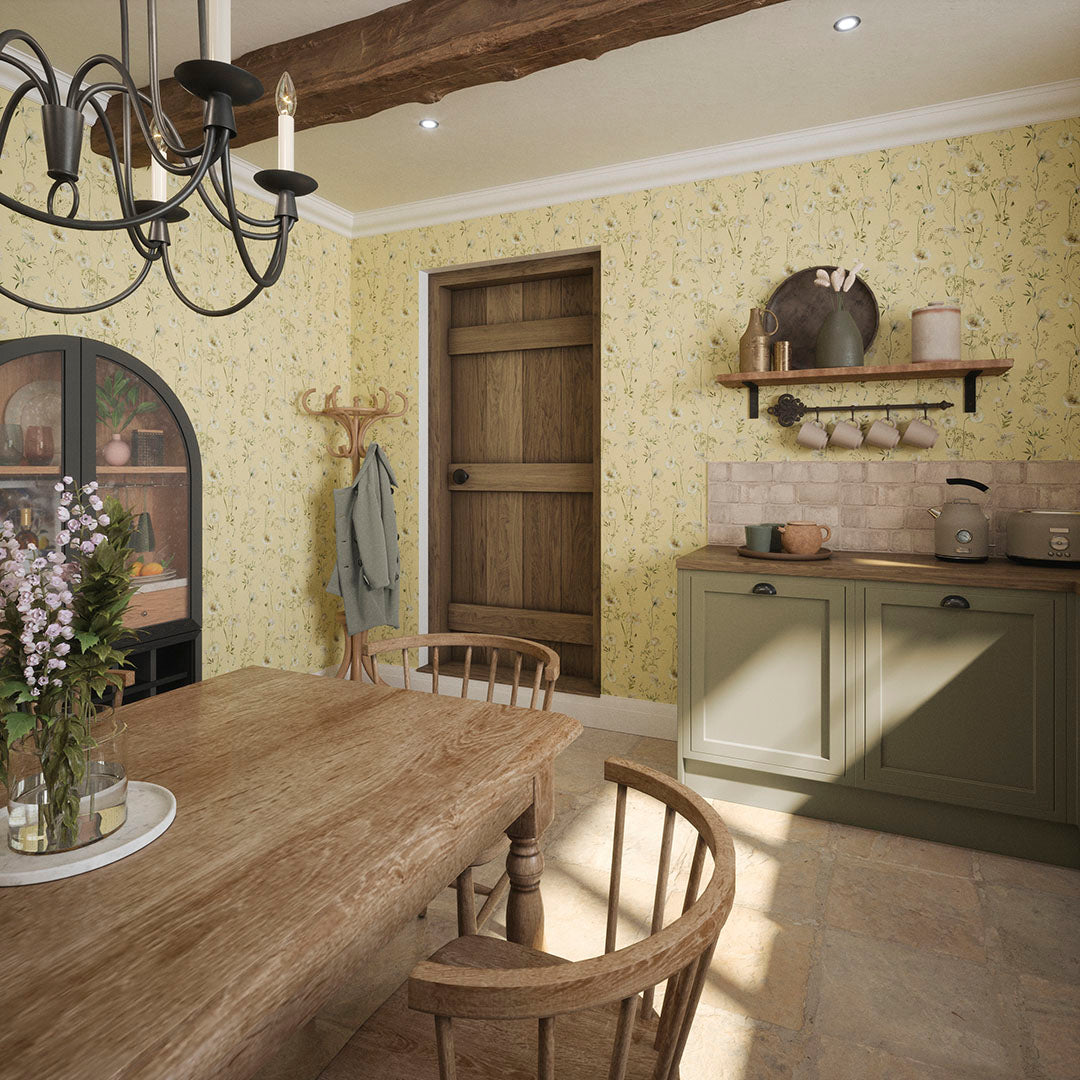 Cottage kitchen setting with wooden furnishings and yellow wallpaper featuring delicate florals. 