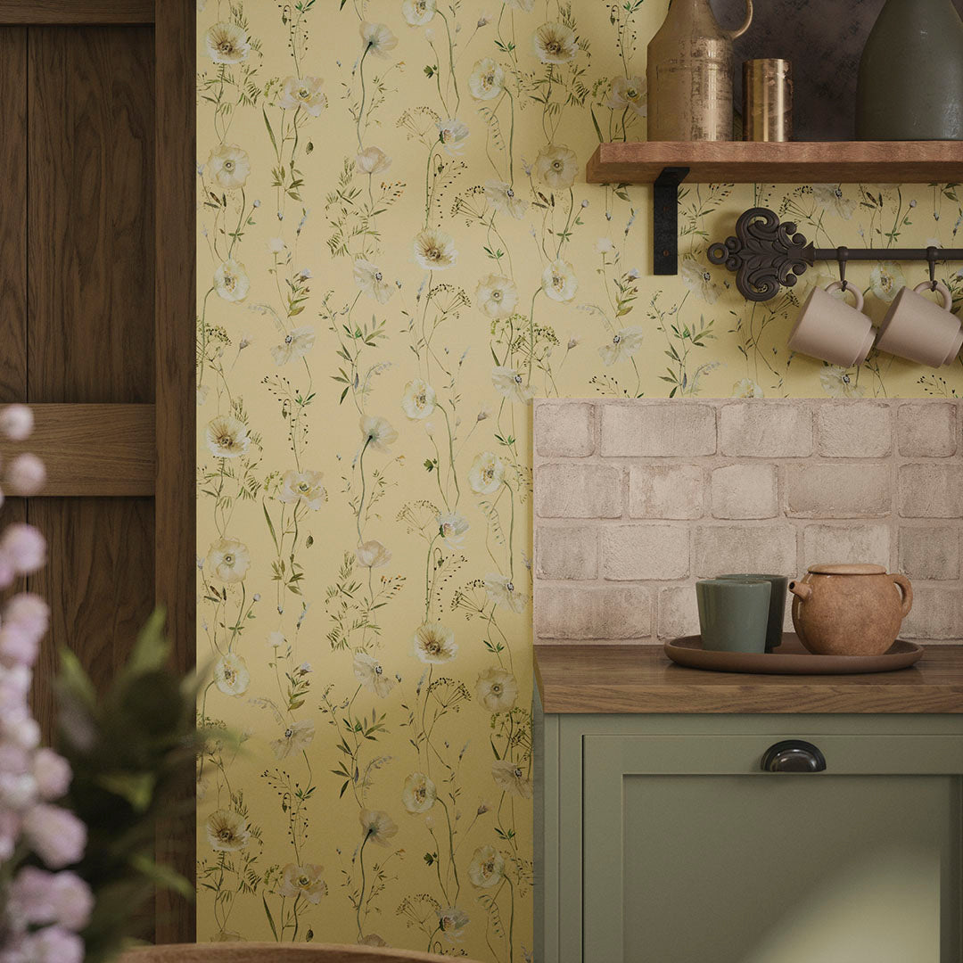 Kitchen with wooden worktops, teacups, and yellow wallpaper featuring cream florals.