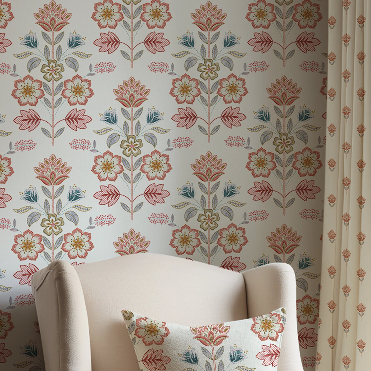 Floral-patterned wallpaper with a chair and matching pillow in the foreground.