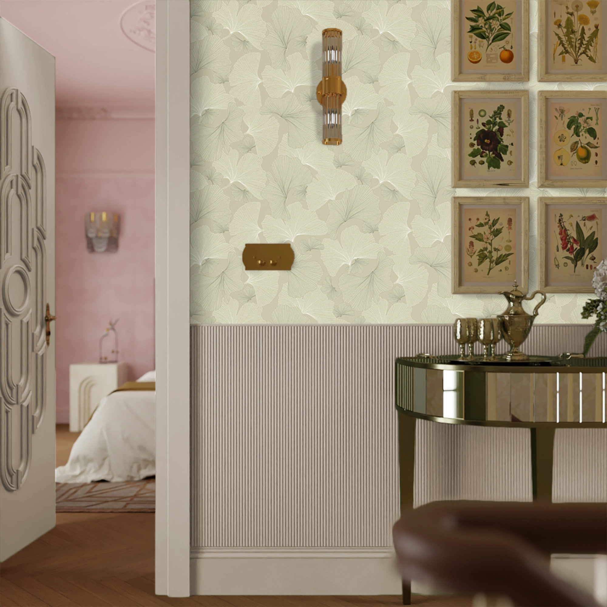 Decorative wall with framed botanical prints in a room with a bed and table.