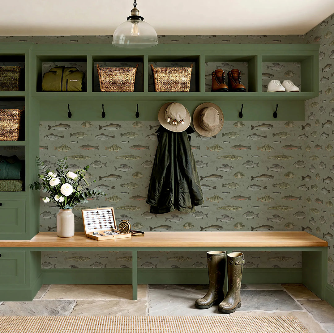 Mudroom setting with fish illustration wallpaper on a green background.