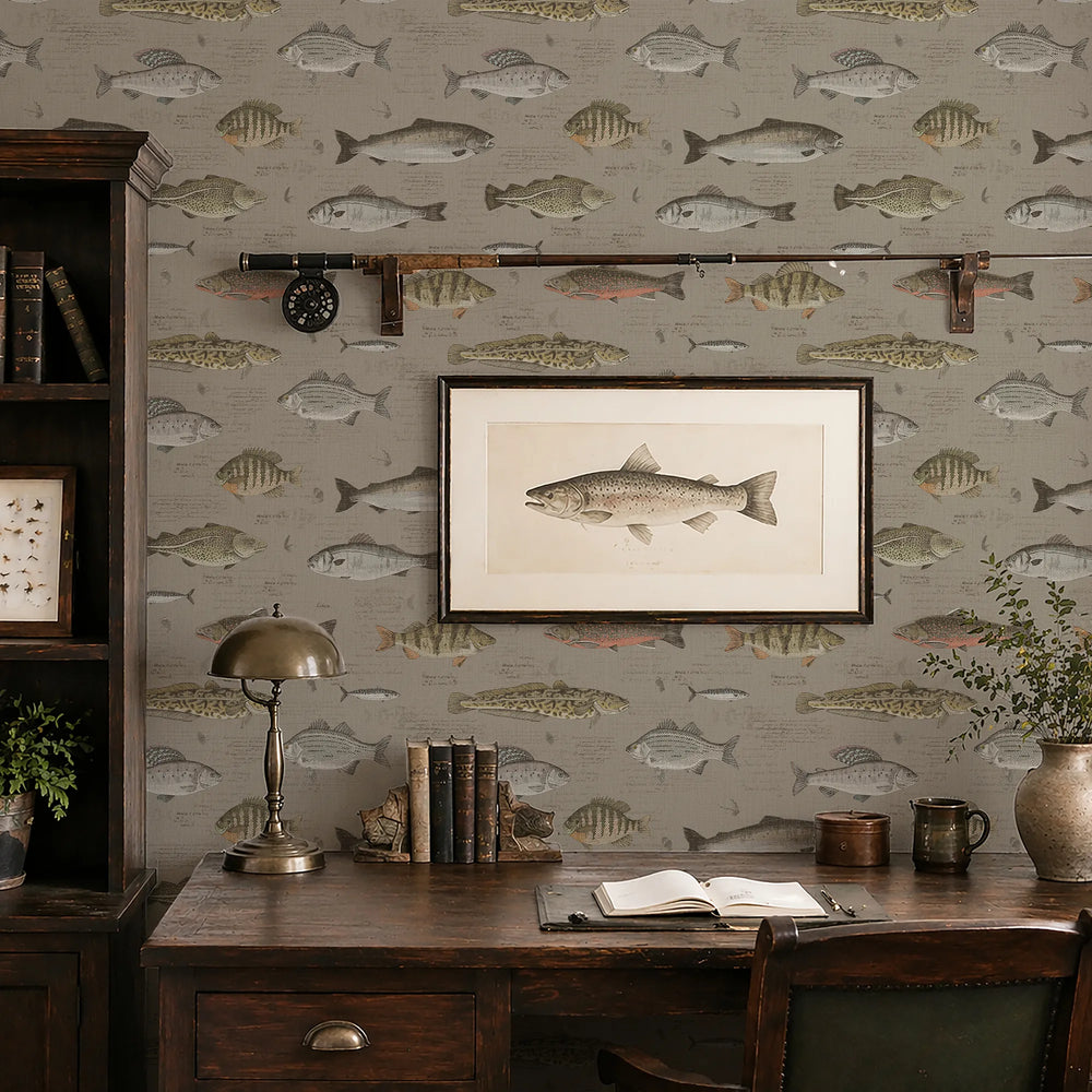 Decorative office with fish-themed wallpaper, framed picture of a fish, and wooden desk.