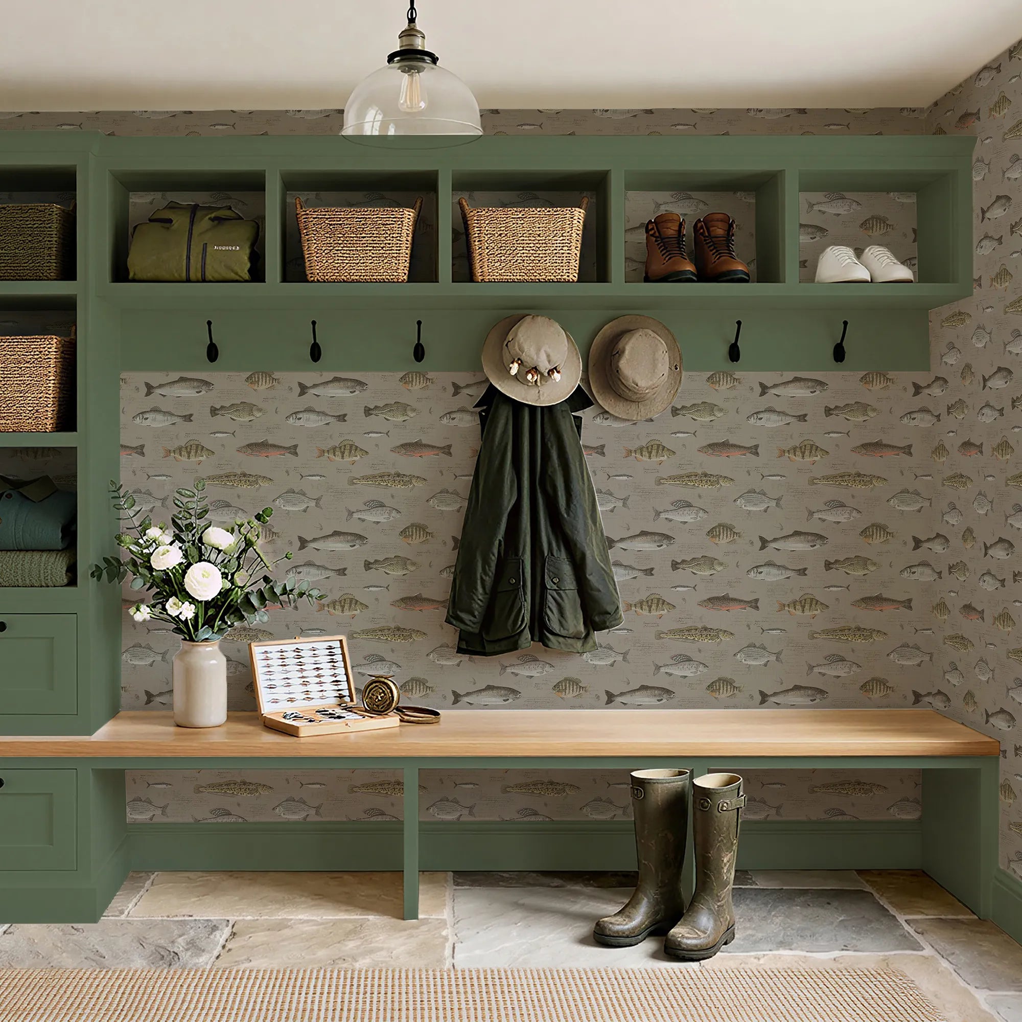 Mudroom setting with green wall storage, wooden bench, and decorative elements.