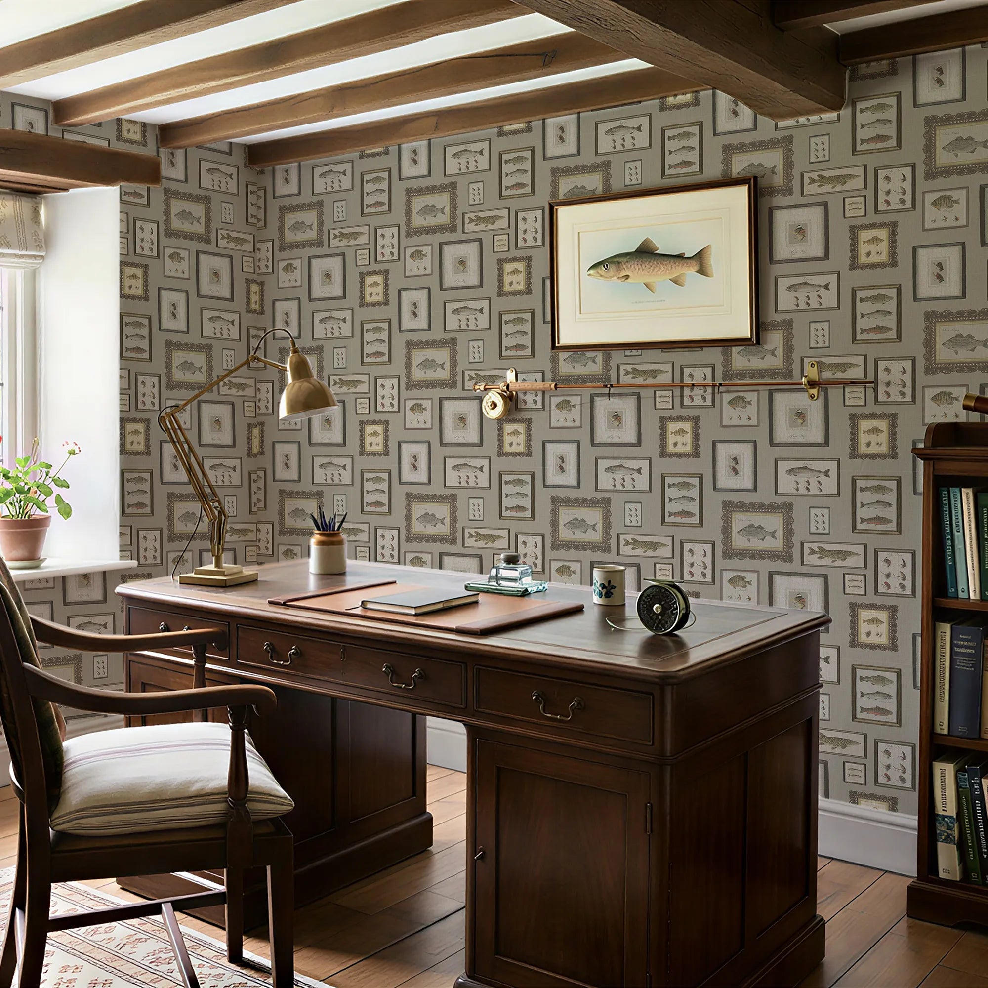 Home office with wooden desk, chair, and wall art in a room with patterned wallpaper.