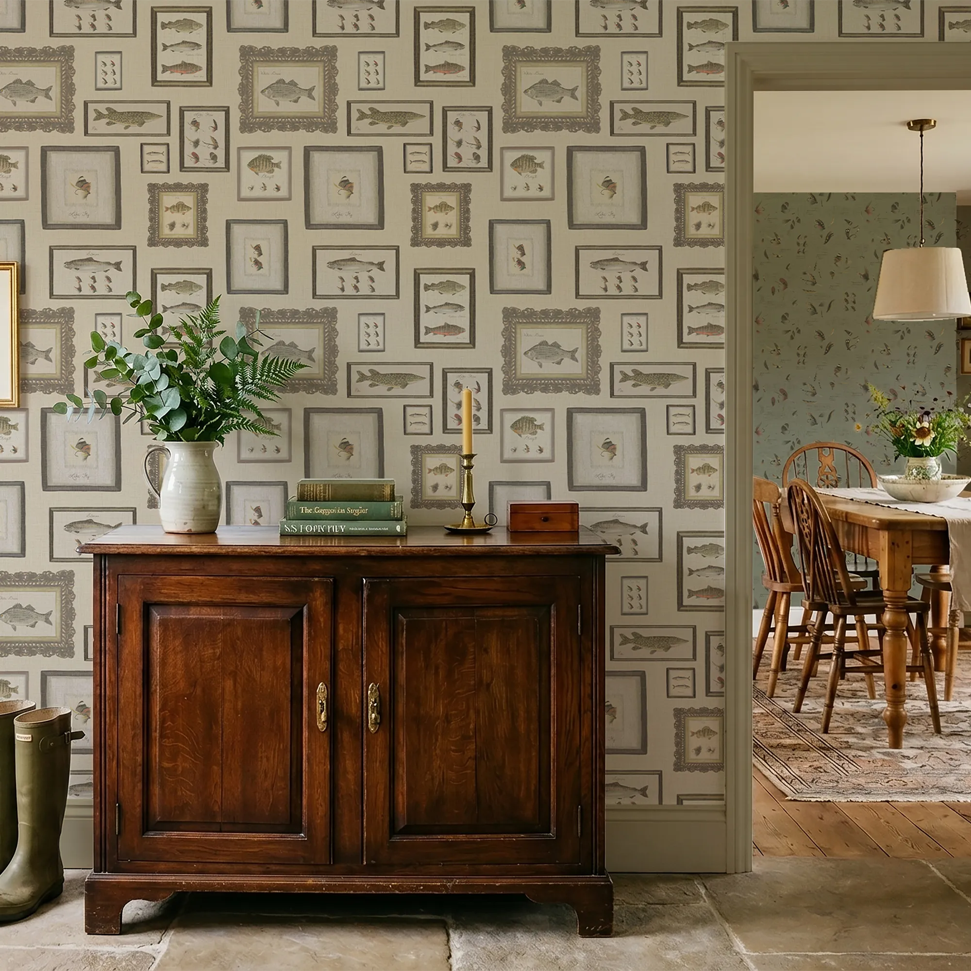 Wooden sideboard with decorative items against a patterned wallpaper wall.